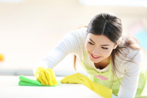 Cleaner maintaining shared stairwell and hallway areas in Battersea